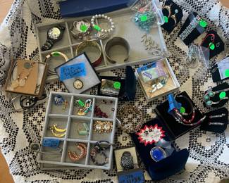 Assortment of costume jewelry. Elgin silver pocket watch that runs 1953