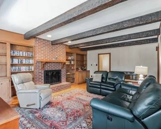 Handsome leather seating; lovely rug