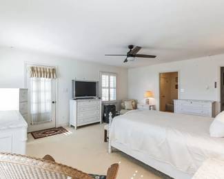 Primary bedroom features a Williams Sonoma Home bedroom suite 