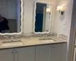 Updated bath: double vanity; mirrors; lights 