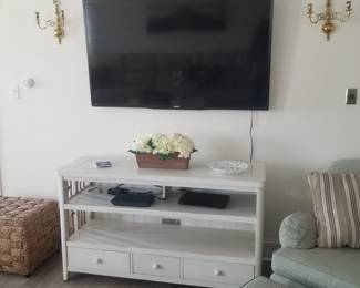 Flat screen TV; white entertainment console