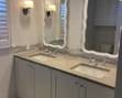 Updated bath: double vanity; mirrors; lights 