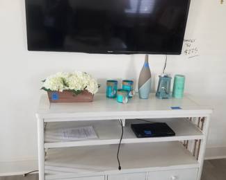 Flat screen TV; white entertainment console - two available