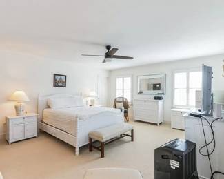 Primary bedroom features a Williams Sonoma Home bedroom suite 