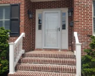 Entry door with two side lights; storm door