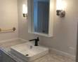 Updated bath: vanity; mirror; lights 