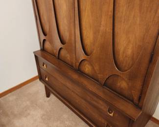 I've fallen in love with this Broyhill Brasilia furniture. I've done a little research and learned that this walnut furniture was introduced at the 1962 World's Fair. It has remained popular since then. 