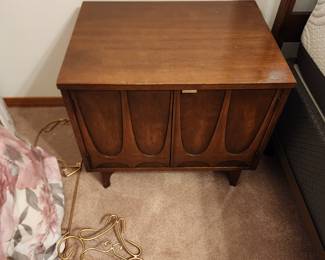 I've fallen in love with this Broyhill Brasilia furniture. I've done a little research and learned that this walnut furniture was introduced at the 1962 World's Fair. It has remained popular since then. 