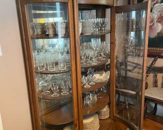 Oak Bow front display cabinet with claw feet