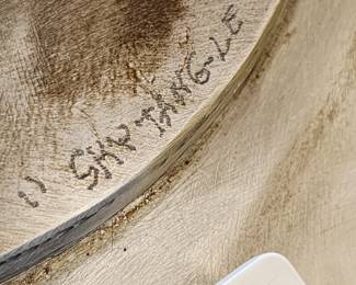 Mark on top of base of sculpture.