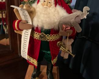  RARE! Stunning Original Lynn Haney Santa Claus "Childhood Treasures" Christmas Figurine. Style number 1200, created in 2000.  Santa Clause stands 17.5" in Height. He has a Sack full of Christmas Gifts & a Christmas Tree on his back, while carrying three cute stuffed animals & a list of all the good kids. 