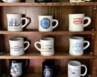 Variety of mugs.  Many are US Navy related.