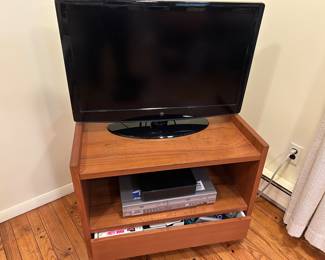 42 inch television and cassette/dvd player and teak cabinet - all sold separately