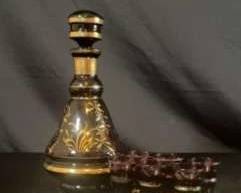 Antique glass carafe with miniature glasses