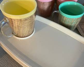 Tumblers, coffee cups, tray, snack trays. 