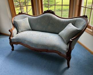 Heirloom vintage mahogany carved settee. Circa 1870’s. Newly upholstered. Sensual lines. 
