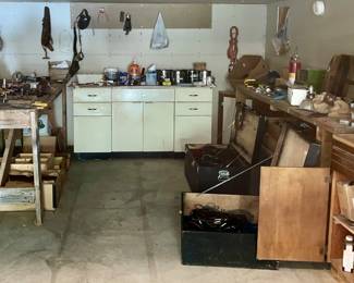 Garage bench tables, $25 each
Metal Cabinet on the back wall $25
Cupboards or cabinets $25 each