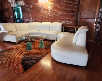 Modern white curvy luxury leather sofa.