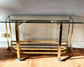 Brass and glass sofa table with some wear to the brass.