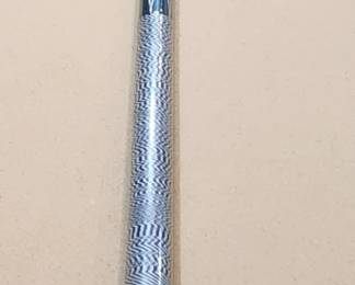 Green and gold cue stick