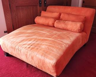 Orange velveteen 2-person chaise. Some staining on side, see photo.