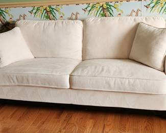 Off white fabric 3 seat sofa with nailhead  arm.