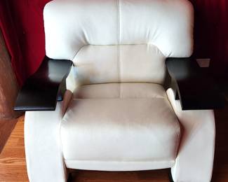 Modern leather arm chair with expresso wood arm rails.