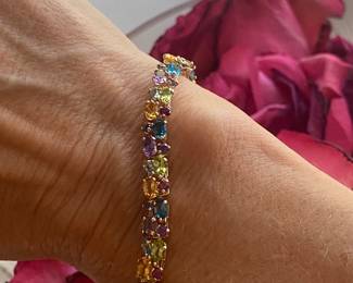 H- $450 Multi colored stones bracelet on 14kt yellow gold. 10.1 gr. 7 1/2"Long. 