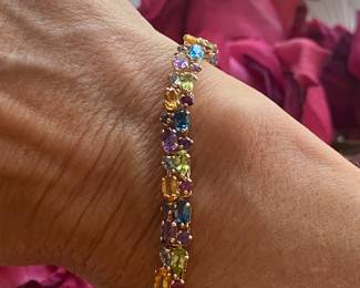 H- $450 Multi colored stones bracelet on 14kt yellow gold. 10.1 gr. 7 1/2"Long. 