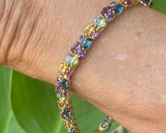 H- $450 Multi colored stones bracelet on 14kt yellow gold. 10.1 gr. 7 1/2"Long. 