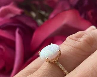 E- $150. Round Opal ring 10kt yellow gold setting 1.6 grams size 6 3/4
