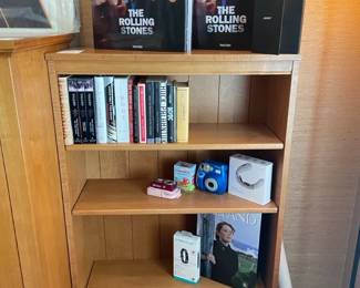 Ethan Allen Bookshelves, The Rolling Stones Taschen Box Set, Polaroid 300 Camera, Books