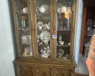 Beautiful vintage china hutch filled with bone china & porcelain pieces.