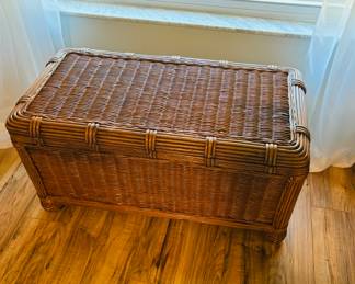 Wicker basket with lid.  Keeps the laundry hidden until you decide it's wash day.