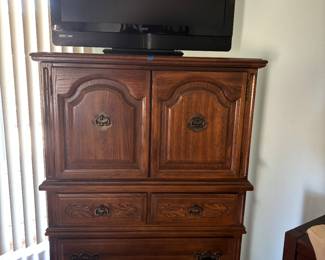 Dresser or tall television stand.  Your choice.