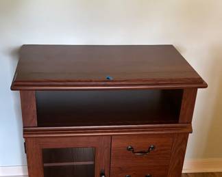 Small table.  Great for hiding the last box of Girl Scout cookies from her / him.