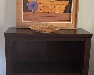 Bookshelf with flowers.  They're not real.  Note the blue tape again.  Let us know when you figure out the purpose.