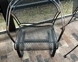 Metal chair.  A cushion might be in order or get the waffle look on your legs.