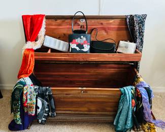 Cedar chest.  Just toss the clothes on it and hang them up when you sober up.