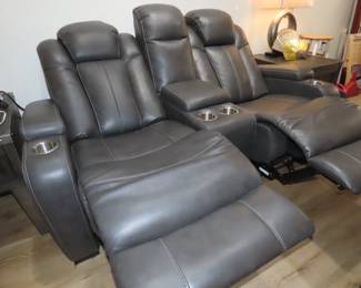 Leather like dual power relining loveseat.