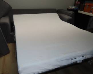 Like new sleeper sofa with throw cushions and memory foam mattress.