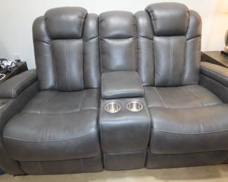 Leather like dual power relining loveseat.