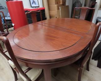 Rosewood dining table and 6 chairs.