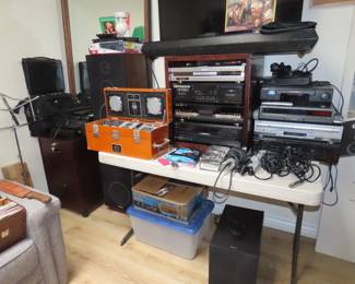 Audio equipment, filing cabinet, Vizio TV, Sony sound bar and sub woofer.