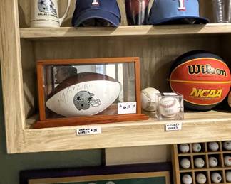 Very rare Marion Barber (#24) autographed Dallas Cowboy Football in a wood and glass display case. Michael Young autographed baseball in protective display case.