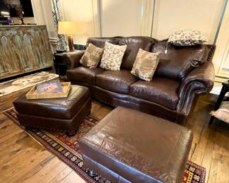 Leather sofa, two overstuffed chairs and two ottomans. 