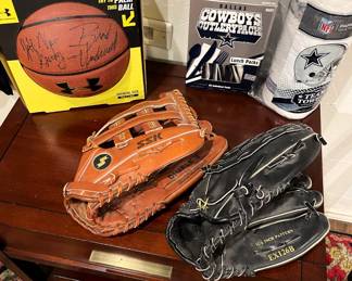 Jeff Gundy, NBA coach and Brad Underwood, previous head coach Stephen F. Austin , autographed basketball.  Ladies' softball gloves.