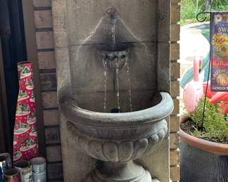Concrete Roman style water fountain.