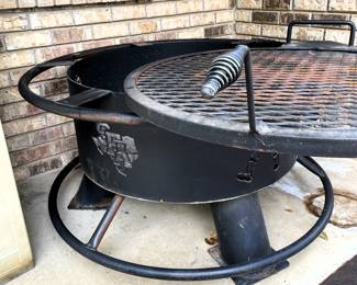 Grill rotated to expose fire pit.