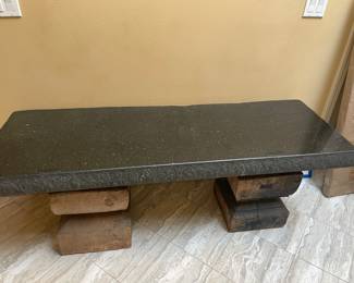 $600 Granite bench on antique wood pedestal base. 60"w X 20"d X 23"h.
